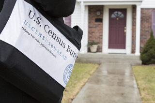 photo = Census Field Worker Approaching House