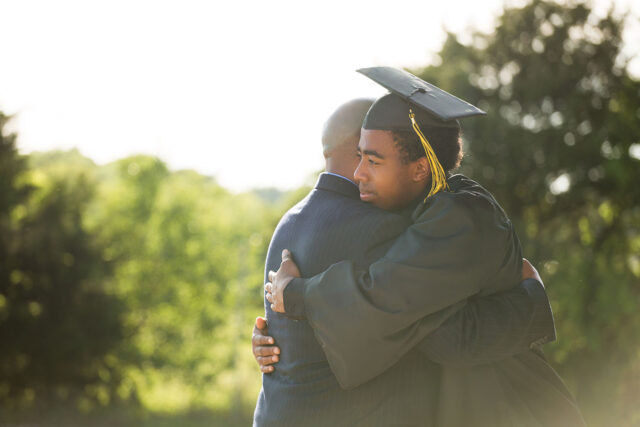 photo - College Graduate Hugging His Father