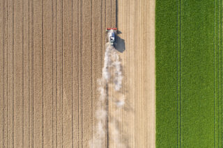 photo - Harvesting a Wheat Field and Dust Clouds
